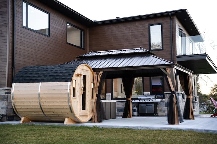 Abdul’s House backyard barrel sauna and covered lounge